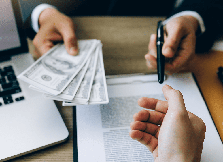 Handing over cash for agreement signing