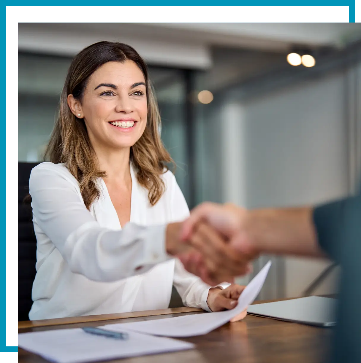 Businesswoman greeting with handshake