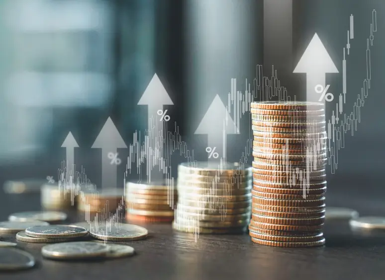 Rising coin stacks and percentage symbols